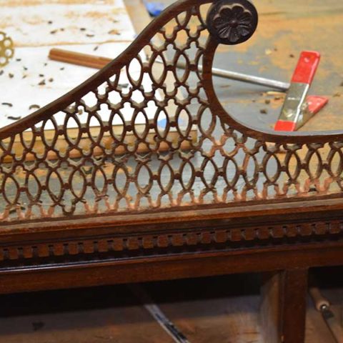 Repair and conservation services for antiques.